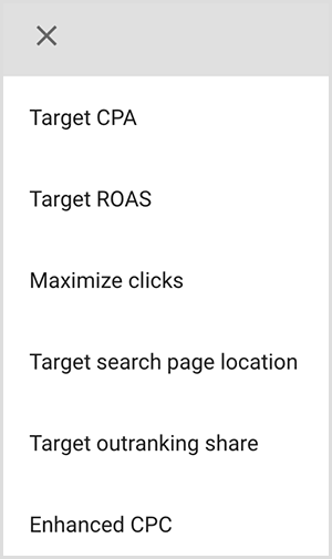 Dies ist ein Screenshot eines Menüs mit Targeting-Optionen in Google Ads. Die Optionen sind Ziel-CPA, Ziel-ROAS, Klicks maximieren, Position der Zielsuchseite, Ziel-Outranking-Freigabe, Verbesserter CPC. Laut Mike Rhodes verwenden intelligente Targeting-Optionen in Google Ads künstliche Intelligenz, um Personen mit der richtigen Absicht für Ihre Anzeige zu finden.